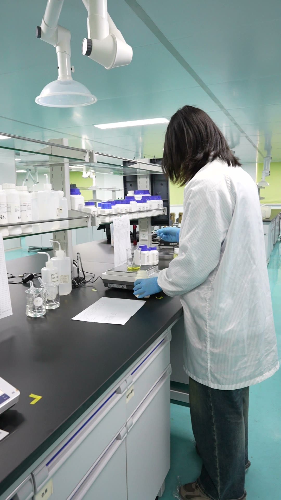Technician working at a lab bench in the YFF R&D centre